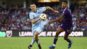 Nov 24, 2024; Orlando, Florida, USA; Atlanta United midfielder Bartosz Slisz (6) and Orlando City midfielder Wilder Cartagena (16) battle for control of the ball during the second half in a 2024 MLS Cup conference semifinal match at Inter&Co Stadium. Mandatory Credit: Nathan Ray Seebeck-Imagn Images