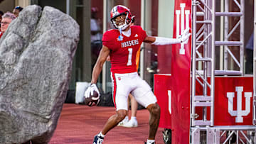Indiana's Donaven McCulley (1) smiles after scoring a touchdown during the Indiana football spring game at Memorial Stadaium on Thursday, April 18, 2024.