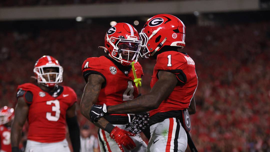 Sep 27, 2025; Athens, Georgia, USA; Georgia Bulldogs defensive back Ellis Robinson IV (1) and defensive back KJ Bolden (4) react in the first half against the Alabama Crimson Tide at Sanford Stadium. Mandatory Credit: Brett Davis-Imagn Images Sep 27, 2025; Athens, Georgia, USA; Georgia Bulldogs defensive back Ellis Robinson IV (1) and defensive back KJ Bolden (4) react in the first half against the Alabama Crimson Tide at Sanford Stadium. Mandatory Credit: Brett Davis-Imagn Images