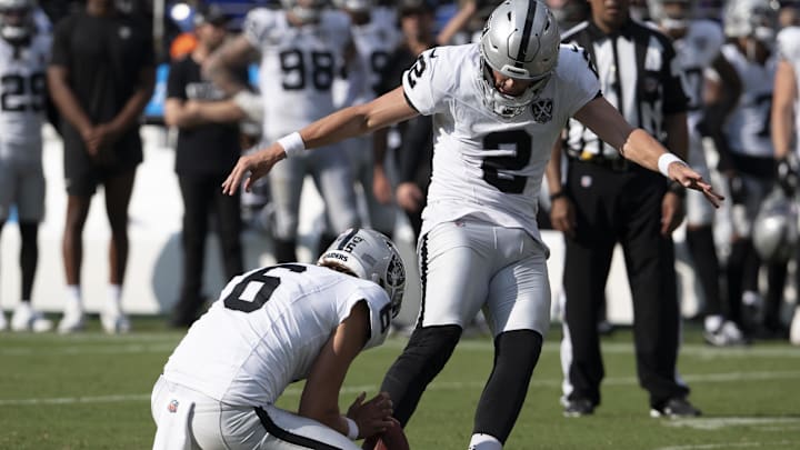 Sep 15, 2024; Baltimore, Maryland, USA; Las Vegas Raiders place kicker Daniel Carlson (2) kicks a game winning field goal  during the second half against the Baltimore Ravens at M&T Bank Stadium. Mandatory Credit: Tommy Gilligan-Imagn Images