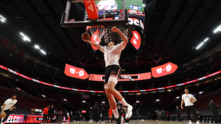 Oct 10, 2025; Portland, OR;  Portland Trail Blazers center Yang Hansen warms up before playing against Sacramento Kings at Moda Center