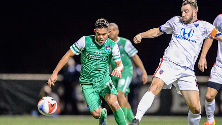 Nov 13, 2016; Queens, NY, USA; New York Cosmos midfielder Andres Flores (11) makes a move around Indy Eleven defender Colin Falvey (32) during the NASL final at Belson Stadium. Mandatory Credit: Dennis Schneidler-Imagn Images Nov 13, 2016; Queens, NY, USA; New York Cosmos midfielder Andres Flores (11) makes a move around Indy Eleven defender Colin Falvey (32) during the NASL final at Belson Stadium. Mandatory Credit: Dennis Schneidler-Imagn Images