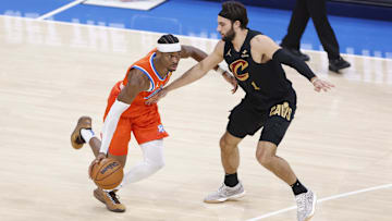 Jan 16, 2025; Oklahoma City, Oklahoma, USA; Oklahoma City Thunder guard Shai Gilgeous-Alexander (2) dribbles the ball down the court as Cleveland Cavaliers guard Max Strus (1) defends during the fourth quarter at Paycom Center. Mandatory Credit: Alonzo Adams-Imagn Images