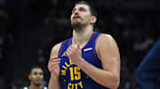Nov 22, 2025; Denver, Colorado, USA; Denver Nuggets center Nikola Jokic (15) walks back to the bench during a timeout while trailing during the second half against the Sacramento Kings at Ball Arena. Mandatory Credit: Christopher Hanewinckel-Imagn Images