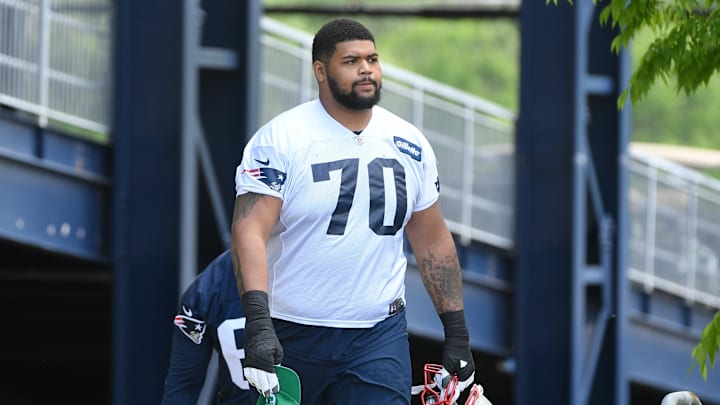 May 23, 2022; Foxborough, MA, USA; New England Patriots offensive tackle Yasir Durant (70) walks to the practice field for the team's OTA at Gillette Stadium. Mandatory Credit: Eric Canha-Imagn Images