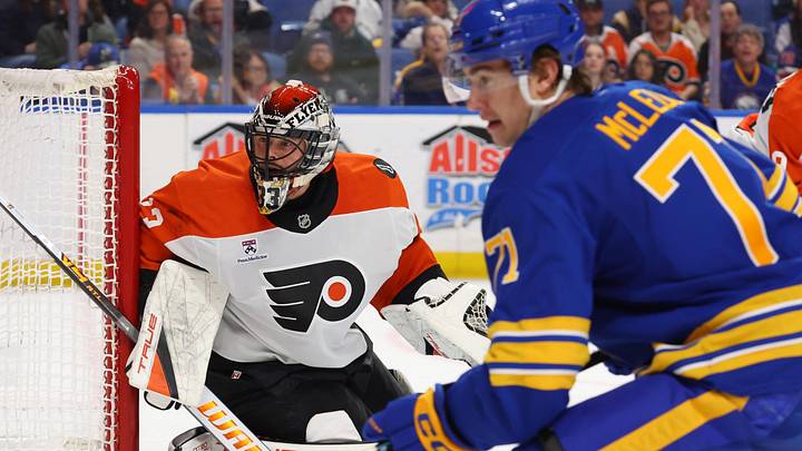 Jan 14, 2026; Buffalo, New York, USA;  Philadelphia Flyers goaltender Samuel Ersson (33) and Buffalo Sabres center Ryan McLeod (71) look for the puck during the second period at KeyBank Center. 