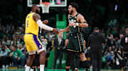 Jan 28, 2023; Boston, Massachusetts, USA; Boston Celtics forward Jayson Tatum (0) and Los Angeles Lakers forward LeBron James (6) react before playing at TD Garden. Mandatory Credit: Paul Rutherford-Imagn Images