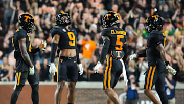 Nov 2, 2024; Knoxville, Tennessee, USA; Tennessee Volunteers defensive back Andre Turrentine (2) celebrates with defensive back Jakobe Thomas (9), defensive back Christian Harrison (5), and defensive back Jalen McMurray (6) after making an interception against the Kentucky Wildcats) during the first half at Neyland Stadium.. Mandatory Credit: Caitie McMekin/USA TODAY Network via Imagn Images