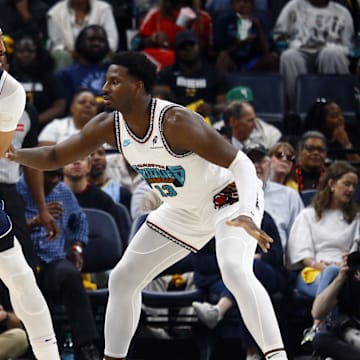 Dallas Mavericks forward Anthony Davis handles the ball against Memphis Grizzlies forward Jaren Jackson Jr.