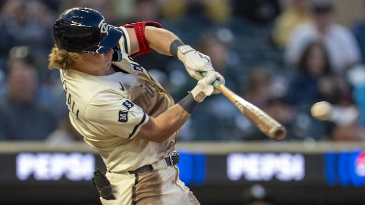 Apr 22, 2025; Minneapolis, Minnesota, USA; Minnesota Twins designated hitter Luke Keaschall (15) hits a single against the Chicago White Sox in the fifth inning at Target Field.