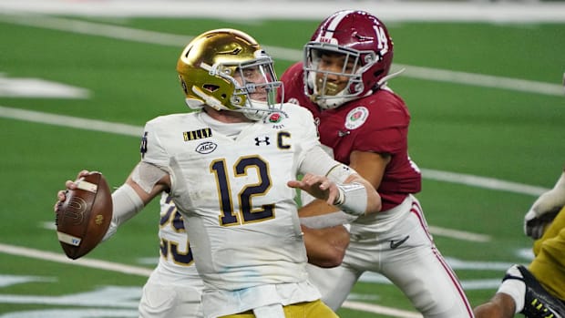 Notre Dame's Ian Book throws a pass against Alabama in the 2021 Rose Bow