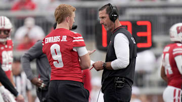 Wisconsin head coach Luke Fickell talks with injured quarterback Billy Edwards Jr. (9) during the fourth quarter of the game Saturday, September 6, 2025 at Camp Randall Stadium in Madison, Wisconsin. Wisconsin beat Middle Tennessee 42-10.