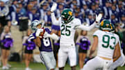 Nov 11, 2023; Manhattan, Kansas, USA; Kansas State Wildcats wide receiver Phillip Brooks (8) catches a punt as Baylor Bears cornerback Levar Thornton Jr. (25) tries to not interfere during the fourth quarter at Bill Snyder Family Football Stadium. 