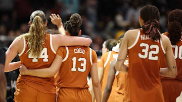 Apr 4, 2025; Tampa, FL, USA;  Texas Longhorns forward Taylor Jones (44) and Texas Longhorns guard Jordana Codio (13) walk off the court after losing to South Carolina Gamecocks during the semifinal of the women's 2025 NCAA tournament at Amalie Arena. Mandatory Credit: Nathan Ray Seebeck-Imagn Images