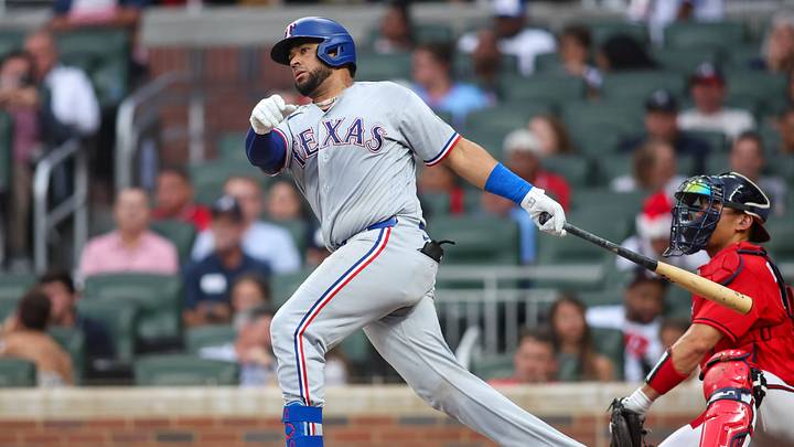 Jul 17, 2026; Atlanta, Georgia, USA; Texas Rangers catcher Elias Diaz (35) hits a single against the Atlanta Braves in the third inning at Truist Park. Mandatory Credit: Brett Davis-Imagn Images