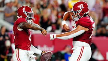 Sep 28, 2024; Tuscaloosa, Alabama, USA; Alabama Crimson Tide quarterback Jalen Milroe (4) celebrates with offensive lineman Parker Brailsford (72) after scoring a touchdown during the first quarter against the Georgia Bulldogs at Bryant-Denny Stadium. Mandatory Credit: John David Mercer-Imagn Images