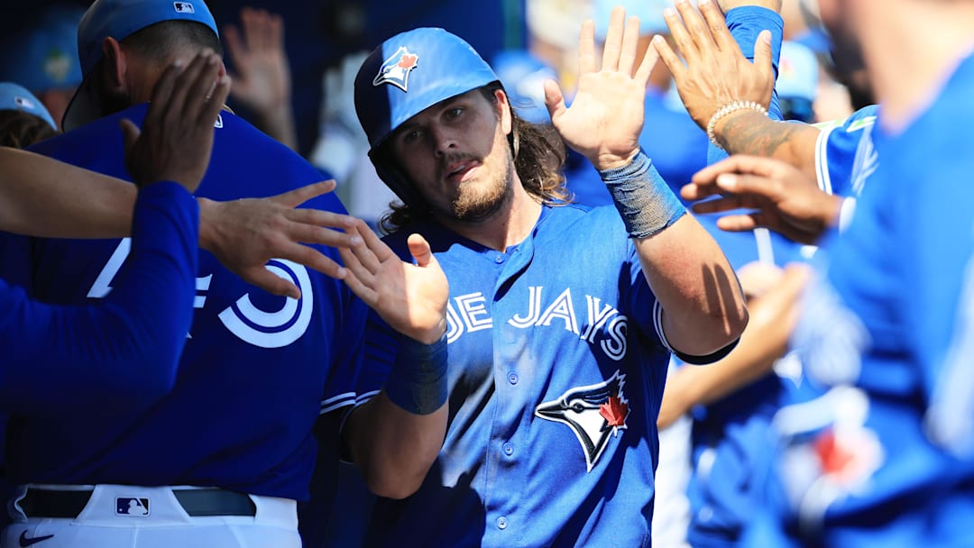 Mar 10, 2026; Dunedin, Florida, USA;  Toronto Blue Jays third baseman Addison Barger (47) celebrates after scoring during the fourth inning against the Atlanta Braves at TD Ballpark. Mandatory Credit: Kim Klement Neitzel-Imagn Images