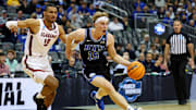 Mar 27, 2025; Newark, NJ, USA; Brigham Young Cougars forward Richie Saunders (15) drives to the basket against Alabama Crimson Tide forward Jarin Stevenson (15) during the first half during an East Regional semifinal of the 2025 NCAA tournament at Prudential Center. Mandatory Credit: Vincent Carchietta-Imagn Images