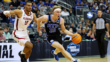 Mar 27, 2025; Newark, NJ, USA; Brigham Young Cougars forward Richie Saunders (15) drives to the basket against Alabama Crimson Tide forward Jarin Stevenson (15) during the first half during an East Regional semifinal of the 2025 NCAA tournament at Prudential Center. Mandatory Credit: Vincent Carchietta-Imagn Images