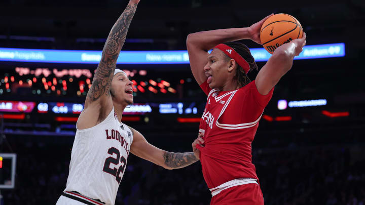 Nov 20, 2023; New York, NY, USA; Indiana Hoosiers forward Malik Reneau (5) is guarded by Louisville Cardinals guard Tre White (22) during the second half at Madison Square Garden. Mandatory Credit: Vincent Carchietta-USA TODAY Sports