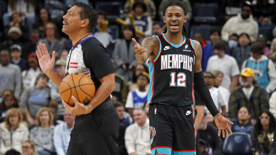 Dec 30, 2025; Memphis, Tennessee, USA; Memphis Grizzlies guard Ja Morant (12) reacts toward official Bill Kennedy during the fourth quarter against the Philadelphia 76ers at FedExForum. Mandatory Credit: Petre Thomas-Imagn Images