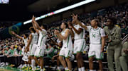 The Oregon bench cheers as the Oregon Ducks host the Montana Grizzlies at Matthew Knight Arena Friday, Nov. 8, 2024 in Eugene, Ore.