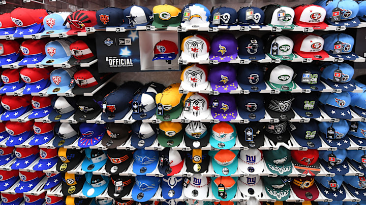 Team hats have become an NFL draft staple. Team hats have become an NFL draft staple.