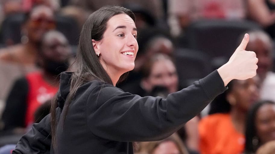 Indiana Fever's Caitlin Clark gives a thumbs up to Los Angeles Sparks's Kelsey Plum after she travels with the ball Saturday, July 19, 2025, during the WNBA All-Star Game at Gainbridge Fieldhouse in Indianapolis. | Grace Smith/IndyStar / USA TODAY NETWORK via Imagn Images