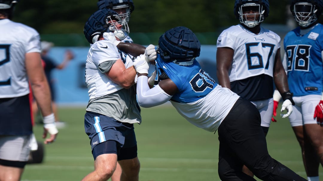 Jul 28, 2023; Nashville, Tennessee, USA; Tennessee Titans defensive tackle Naquan Jones (90) battles against offensive lineman Daniel Brunskill during preseason training at Ascension Saint Thomas Sports Park. Mandatory Credit: Denny Simmons/The Tennessean-USA TODAY Sports
