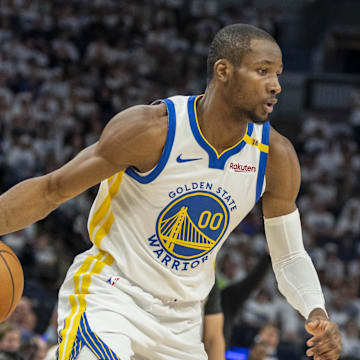 May 8, 2025; Minneapolis, Minnesota, USA; Golden State Warriors forward Jonathan Kuminga (00) dribbles the ball against the Minnesota Timberwolves in the second half during game two of the second round for the 2025 NBA Playoffs at Target Center. Mandatory Credit: Jesse Johnson-Imagn Images