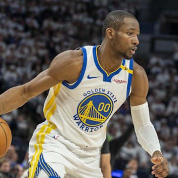 May 8, 2025; Minneapolis, Minnesota, USA; Golden State Warriors forward Jonathan Kuminga (00) dribbles the ball against the Minnesota Timberwolves in the second half during game two of the second round for the 2025 NBA Playoffs at Target Center. Mandatory Credit: Jesse Johnson-Imagn Images
