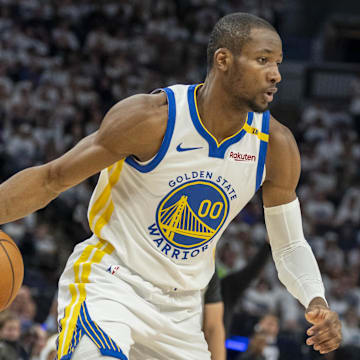 May 8, 2025; Minneapolis, Minnesota, USA; Golden State Warriors forward Jonathan Kuminga (00) dribbles the ball against the Minnesota Timberwolves in the second half during game two of the second round for the 2025 NBA Playoffs at Target Center. Mandatory Credit: Jesse Johnson-Imagn Images