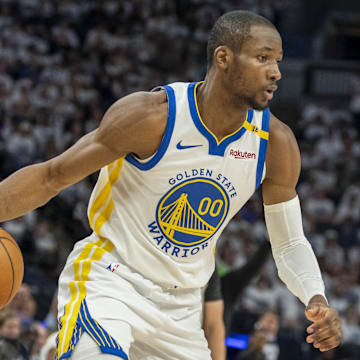 May 8, 2025; Minneapolis, Minnesota, USA; Golden State Warriors forward Jonathan Kuminga (00) dribbles the ball against the Minnesota Timberwolves in the second half during Game 2 of the second round for the 2025 NBA Playoffs at Target Center.