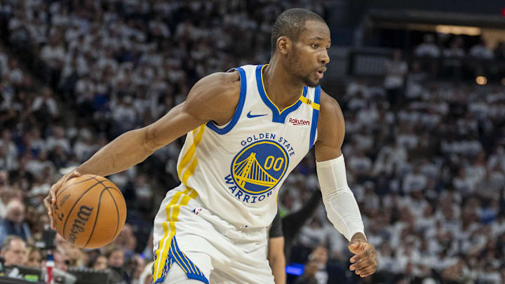 May 8, 2025; Minneapolis, Minnesota, USA; Golden State Warriors forward Jonathan Kuminga (00) dribbles the ball against the Minnesota Timberwolves in the second half during Game 2 of the second round for the 2025 NBA Playoffs at Target Center.