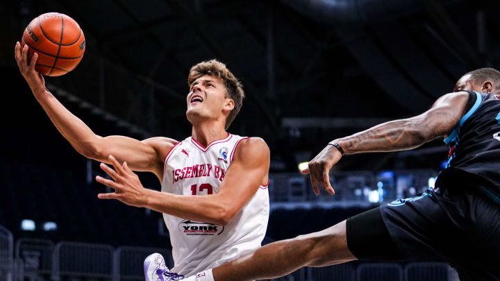 Assembly Ball's Miller Kopp (12) goes up for a layup on Tuesday during The Basketball Tournament at Hinkle Fieldhouse in Indianapolis.