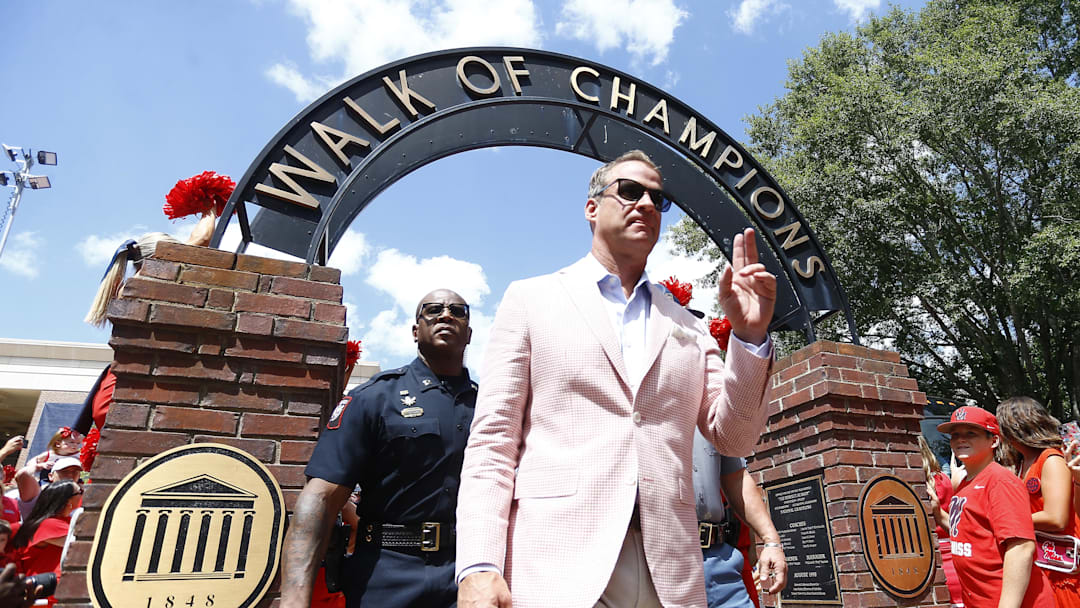 Sep 7, 2024; Oxford, Mississippi, USA; Mississippi Rebels head coach Lane Kiffin makes his makes his way down the Walk of Champions prior to the game against the Middle Tennessee Blue Raiders at Vaught-Hemingway Stadium. Mandatory Credit: Petre Thomas-Imagn Images