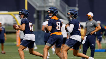 Jul 26, 2024; Englewood, CO, USA; Denver Broncos quarterback Bo Nix (10) and quarterback Jarrett Stidham (8) and quarterback Zach Wilson (4) during training camp at Broncos Park Powered by CommonSpirit. Mandatory Credit: Isaiah J. Downing-USA TODAY Sports