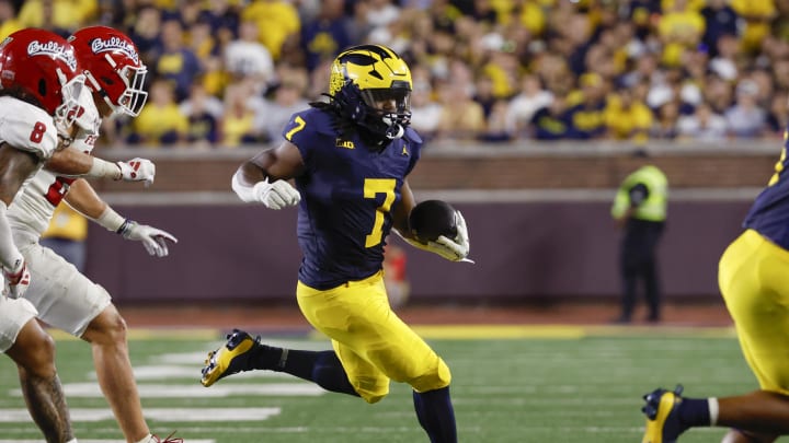 Aug 31, 2024; Ann Arbor, Michigan, USA;  Michigan Wolverines running back Donovan Edwards (7) runs the ball against the Fresno State Bulldogs in the first half at Michigan Stadium. Mandatory Credit: Rick Osentoski-USA TODAY Sports