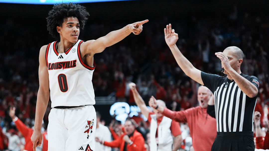Louisville Cardinals guard Mikel Brown Jr. (0) celebrates his three-point shot as the Cards go up over Kentucky in the first half during the UofL-UK annual rivalry game at the KFC Yum! Center in Louisville, Kentucky Nov. 11, 2025.