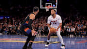 Nov 14, 2025; New York, New York, USA; Miami Heat guard Norman Powell (24) shoots a three point shot against New York Knicks guard Josh Hart (3) during the fourth quarter at Madison Square Garden. Mandatory Credit: Brad Penner-Imagn Images