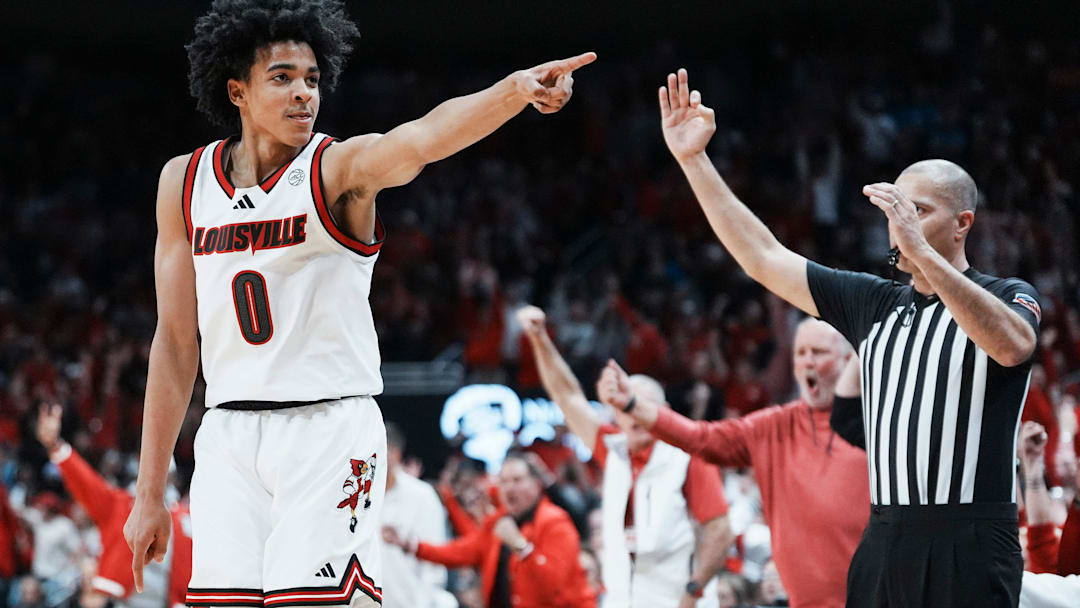 Louisville Cardinals guard Mikel Brown Jr. (0) celebrates his three-point shot as the Cards go up over Kentucky in the first half during the UofL-UK annual rivalry game at the KFC Yum! Center in Louisville, Kentucky Nov. 11, 2025.