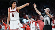 Louisville Cardinals guard Mikel Brown Jr. (0) celebrates his three-point shot as the Cards go up over Kentucky in the first half during the UofL-UK annual rivalry game at the KFC Yum! Center in Louisville, Kentucky Nov. 11, 2025.