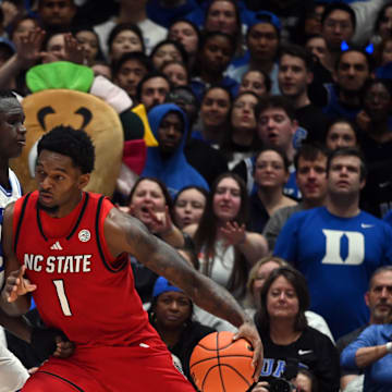 Jan 27, 2025; Durham, North Carolina, USA; North Carolina State Wolfpack forward Brandon Huntley-Hatfield (1) drives against Duke Blue Devils center Khaman Maluach (9) during the second half at Cameron Indoor Stadium.  The Blue Devils won 74-64. Mandatory Credit: Rob Kinnan-Imagn Images