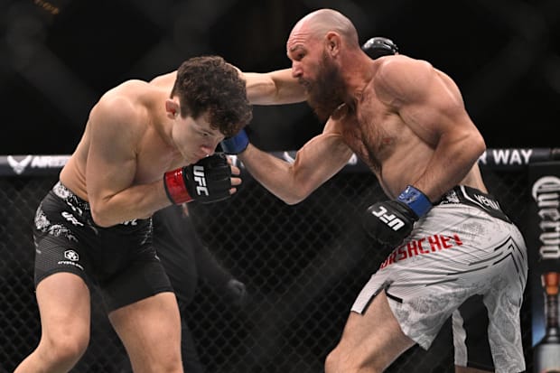Chase Hooper (red gloves) fights Viacheslav Borshchev (blue gloves) during UFC Fight Night at Enterprise Center. 