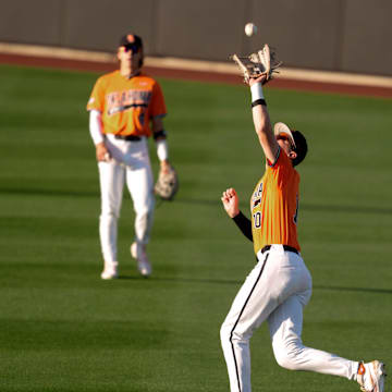 Oklahoma State outfielder Nolan Schubart (10) catches the ball for an out in the third inning of a college Bedlam baseball game between the University of Oklahoma Sooners (OU) and the Oklahoma State University Cowboys (OSU) at O'Brate Stadium in Stillwater, Okla., Tuesday, April 15, 2025.