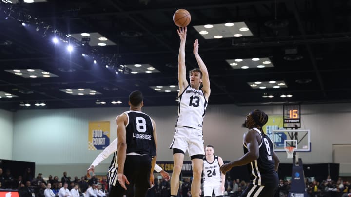 Feb 18, 2024; Indianapolis, Indiana, USA; Team Giraffe Stars forward Matas Buzelis (13) of the G League Ignite shoots the ball over Team BallIsLife forward-center Skal Labissiere (8) of the Stockton Kings during the G-League Next Up game at Indiana Convention Center. Mandatory Credit: Trevor Ruszkowski-USA TODAY Sports