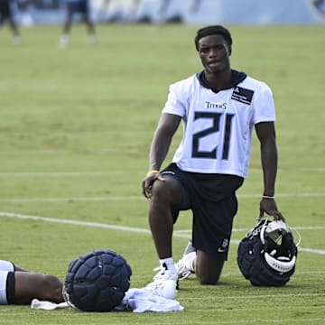 Jul 24, 2025; Nashville, TN, USA;  Tennessee Titans cornerback Roger McCreary (21) and running back Jordan Mims (24) hang out on the field during training camp at Ascension Saint Thomas Sports Park. Mandatory Credit: Steve Roberts-Imagn Images