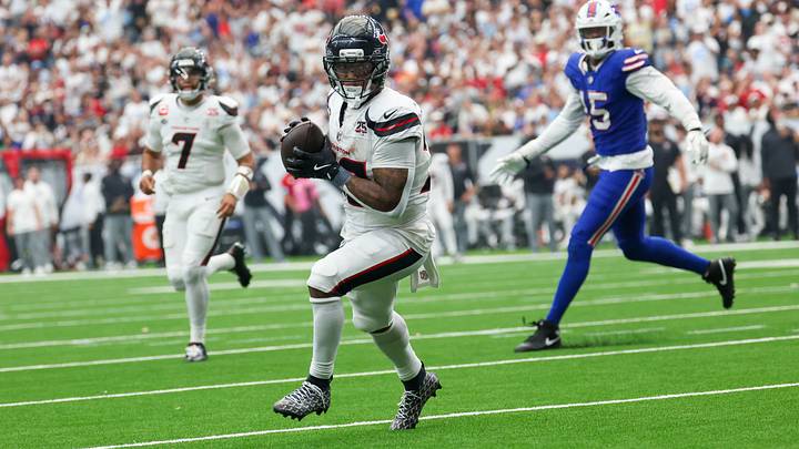 Sep 13, 2026; Houston, Texas, USA; Houston Texans running back David Montgomery (32) catches a touchdown pass from quarterback C.J. Stroud (7) against the Buffalo Bills in the second half at Reliant Stadium. Mandatory Credit: Thomas Shea-Imagn Images