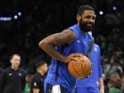 Dallas Mavericks guard Kyrie Irving (11) warms up before game two of the 2024 NBA Finals between the Boston Celtics and the Dallas Mavericks at TD Garden
