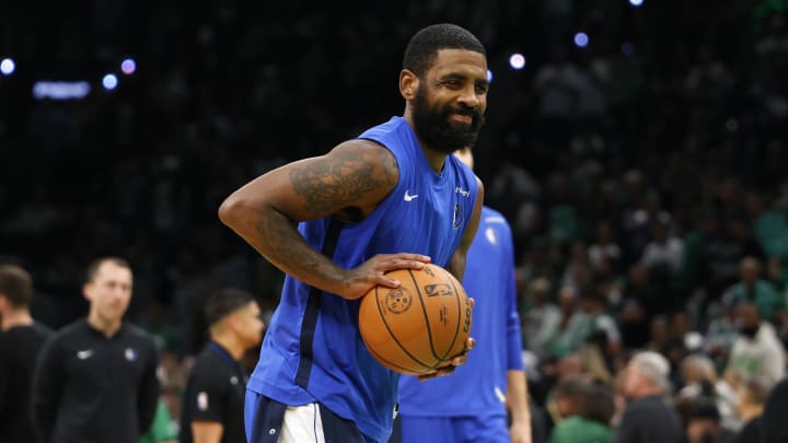 Dallas Mavericks guard Kyrie Irving (11) warms up before game two of the 2024 NBA Finals between the Boston Celtics and the Dallas Mavericks at TD Garden